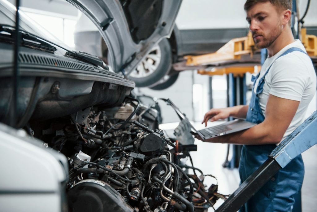 Better verify this in internet. Employee in the blue colored uniform works in the automobile salon